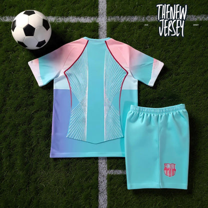 Kids football jersey and shorts set pink design laid flat
