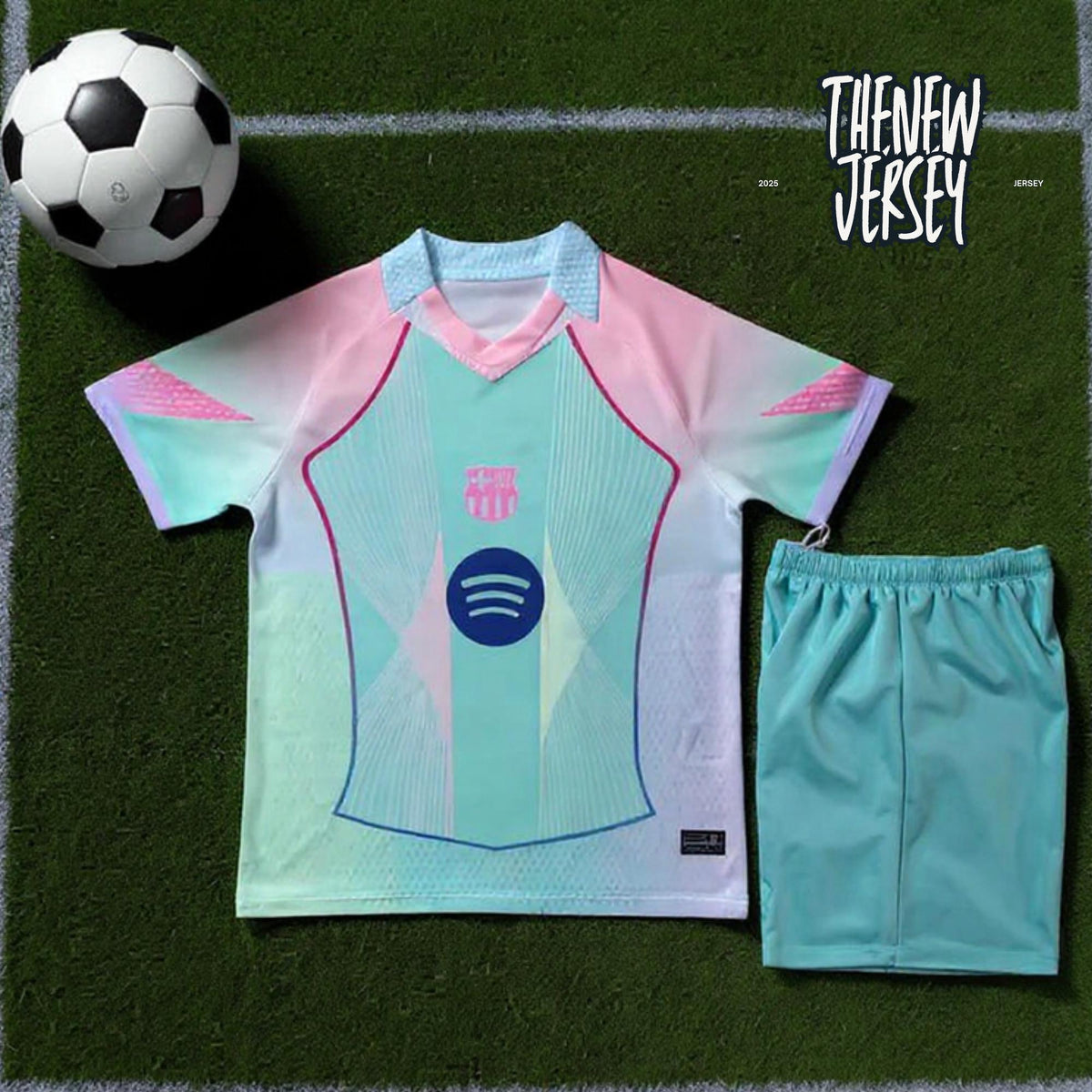 Kids football kit jersey and shorts pink and green flat lay
