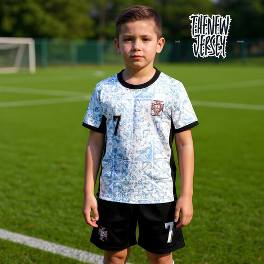 Child wearing Portugal inspired kids football kit with number seven, standing on a soccer field
